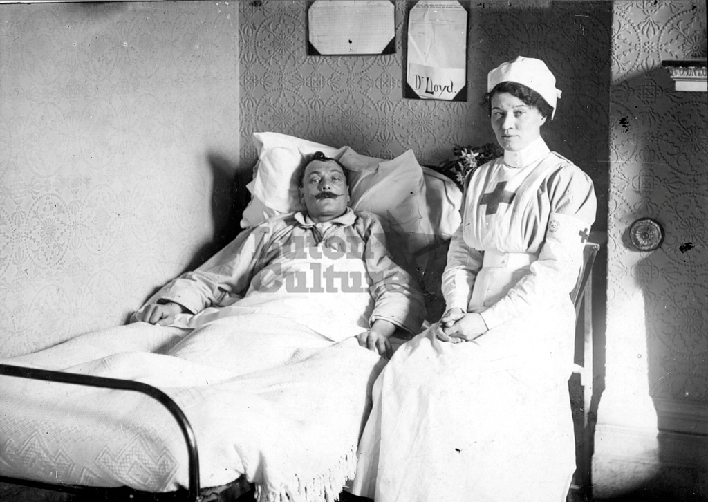 Nurse bedside patient in Wardown Hospital