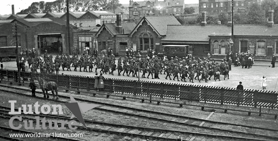 tropps marching to Luton Station
