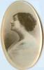 A locket shaped photograph of a woman